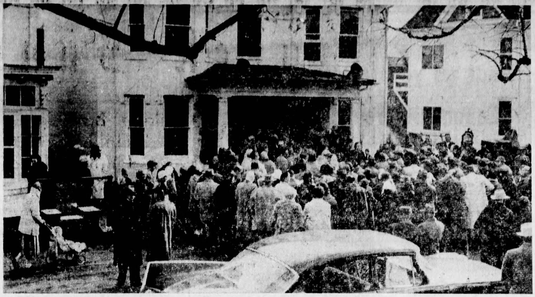 A large crowd dressed for the late November weather gather in front of the house on Parsonage Street in Newville for the auction.