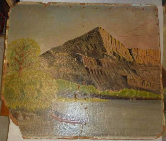 Photo of a wall mural of a mountain with lake and a small boat painted by a POW.