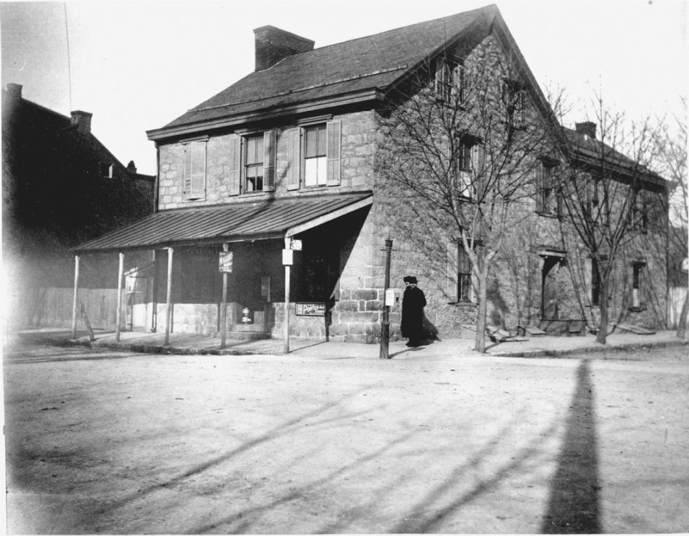 Photo of the stone house at corner of Bedford and Louther Streets, operated as the Sign of the Thirteen Stripes tavern.