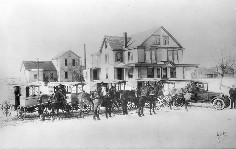 Image of J N Kruger Dairy in 1924 showing horses and delivery carts