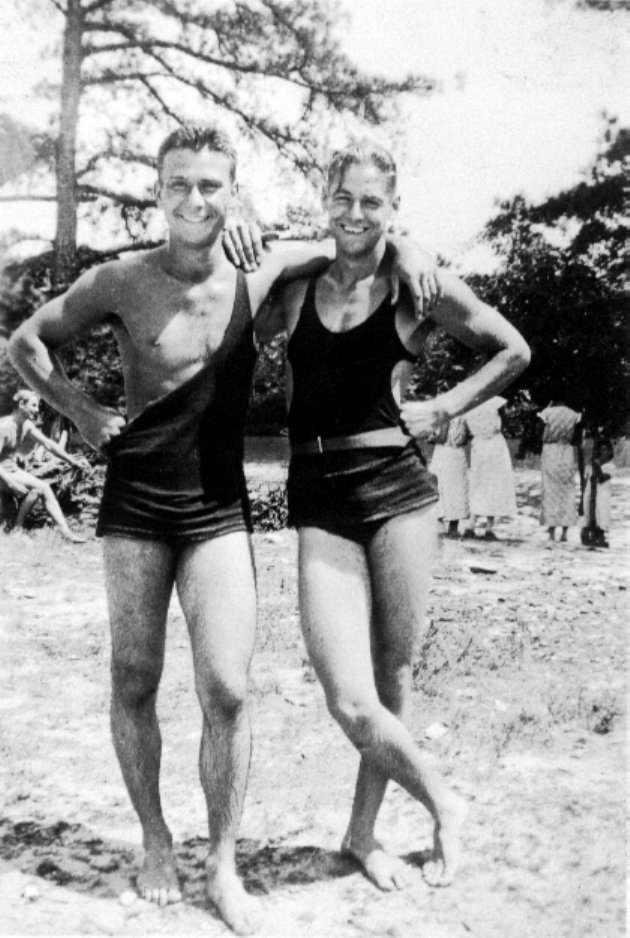 Photo of Black & white photo of two men in bathing suits with other people in Big Pond,  South Newton, Pennsylvania in the background.
