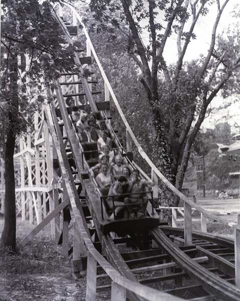Image of the "Blue Streak" roller coaster at the base of the first drop at Willow Mill Park