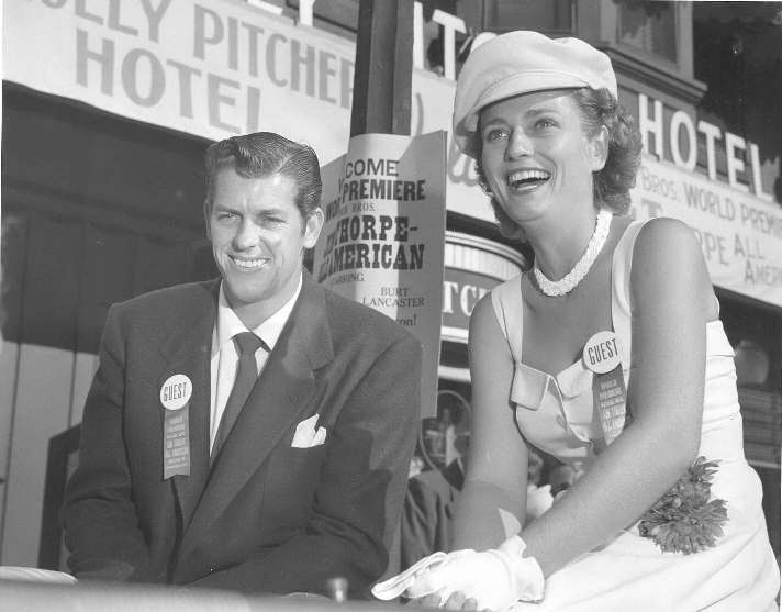 Photo of Mr. and Mrs. Jimmy Brown in parade in front of Molly Pitcher Hotel