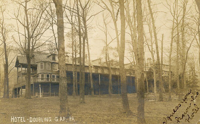 Divided back postcard with B&W outdoor photo of Doubling Gap Hotel among trees without leaves